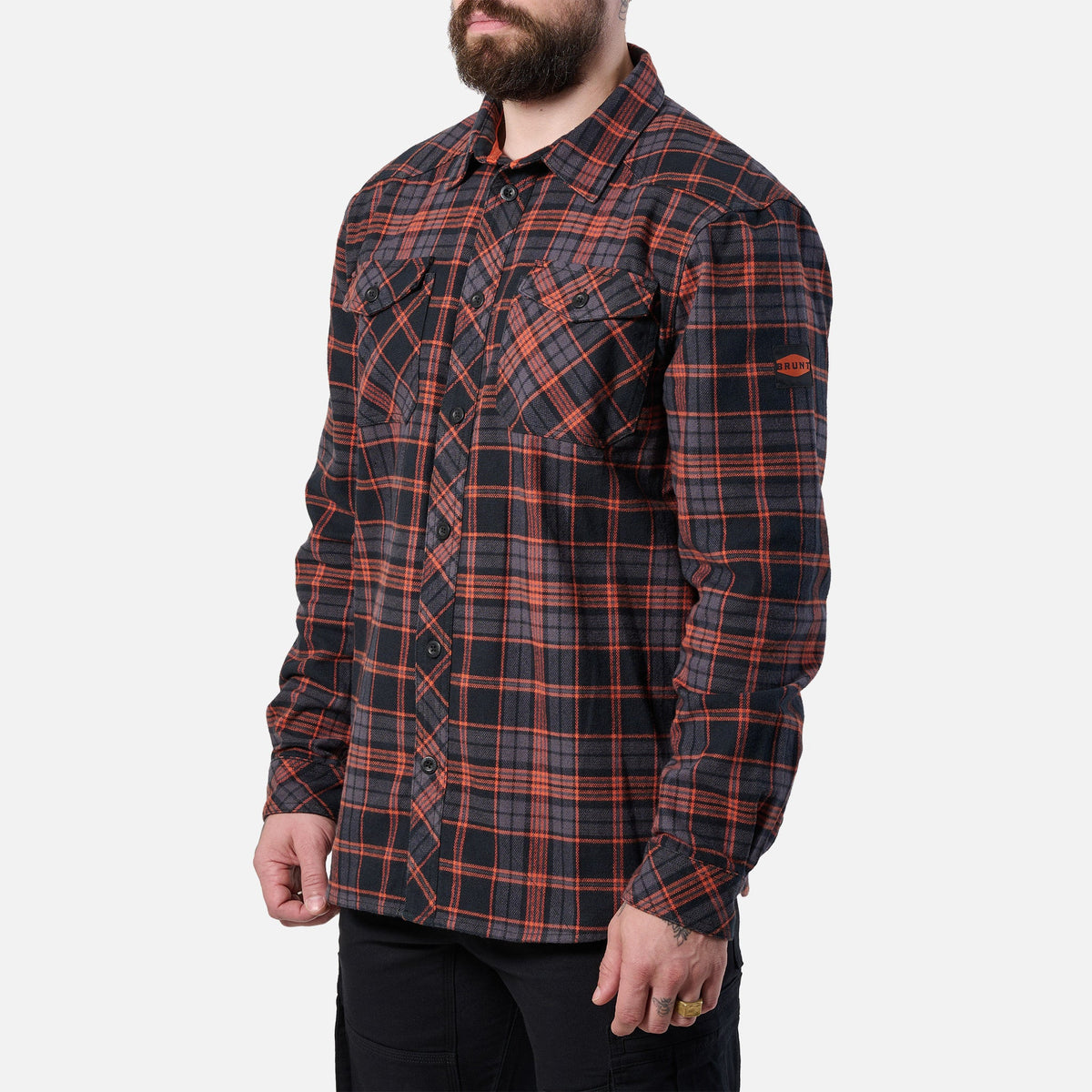 45 degree angle of the right BRUNT heavy duty stretch work flannel in orange and black plaid * 2