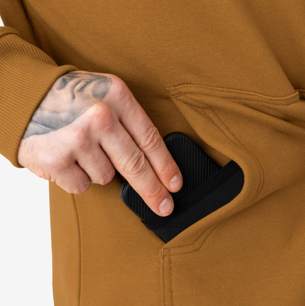 Front of hand pocket of the BRUNT water resistant shevlin work hoodie in saddle