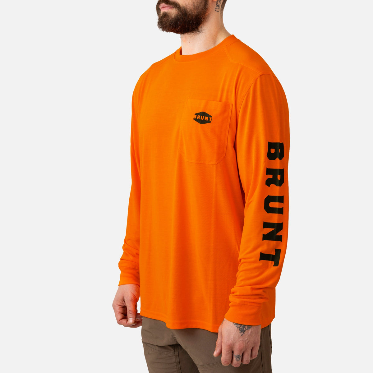 45 degree angle of the front left of the BRUNT high quality long sleeve pocket tee in safety orange