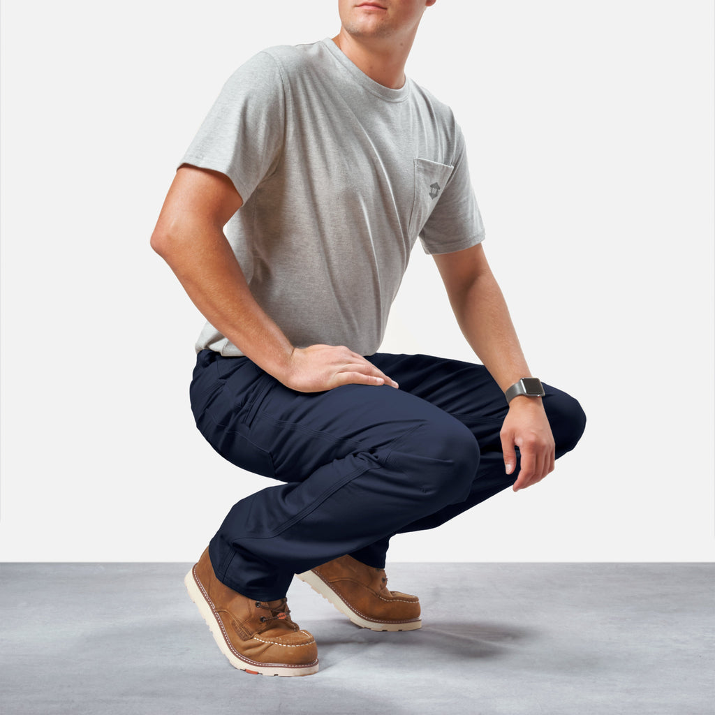 Squatting in BRUNT water resistant stretch torra work pant in dark navy * 0