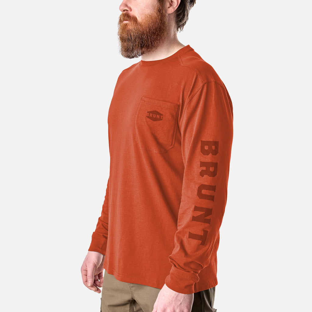 45 degree angle of the front left of the BRUNT high quality long sleeve pocket tee in BRUNT orange * 3