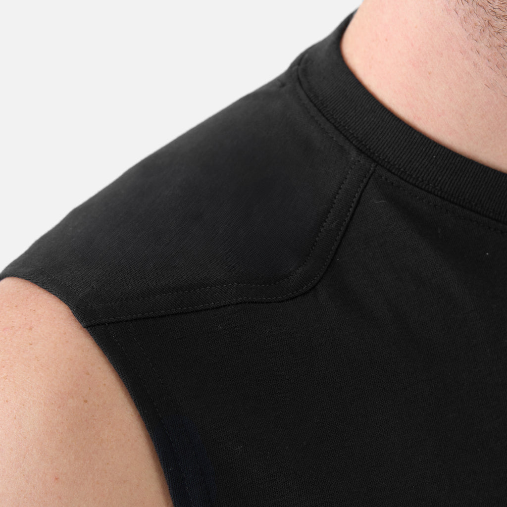 Close up of the drop shoulder of the BRUNT comfortable sleeveless pocket tee in black * 0