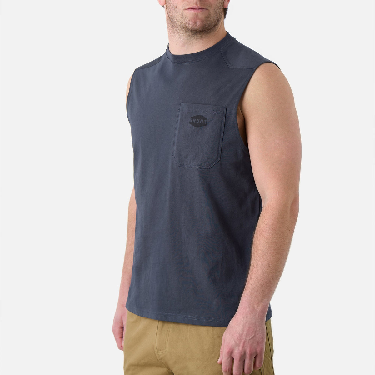 45 degree angle of the front left of the BRUNT comfortable sleeveless pocket tee in navy blue * 4