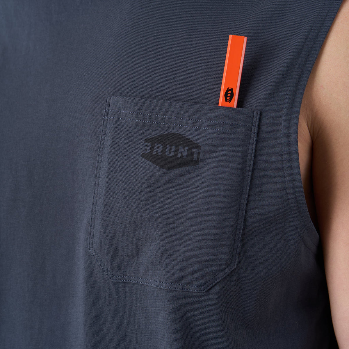 View 2 front of chest pocket with pencil slot of the BRUNT comfortable sleevless pocket tee in navy blue * 4