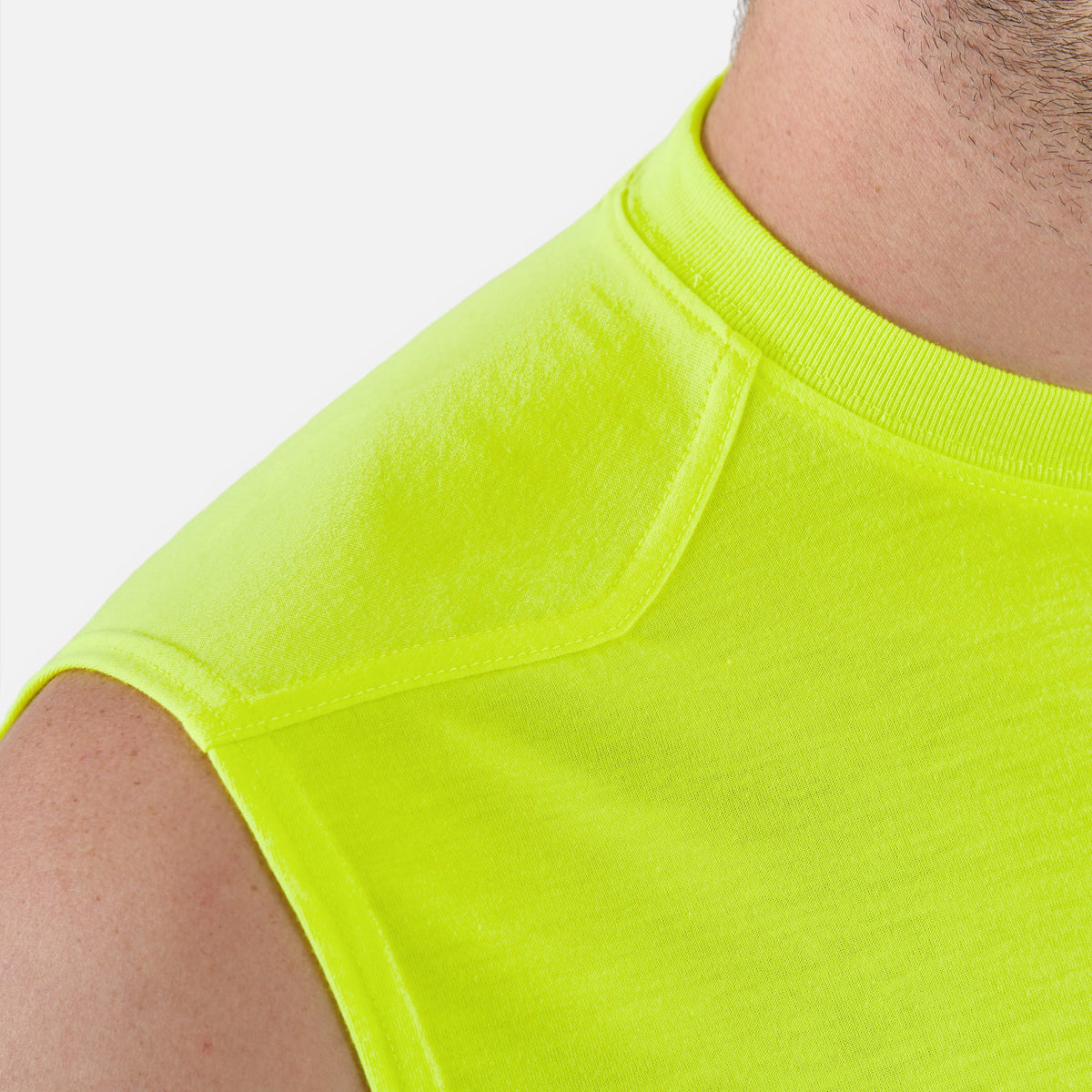 Close up of the drop shoulder of the BRUNT comfortable sleeveless pocket tee in hi vis yellow * 3