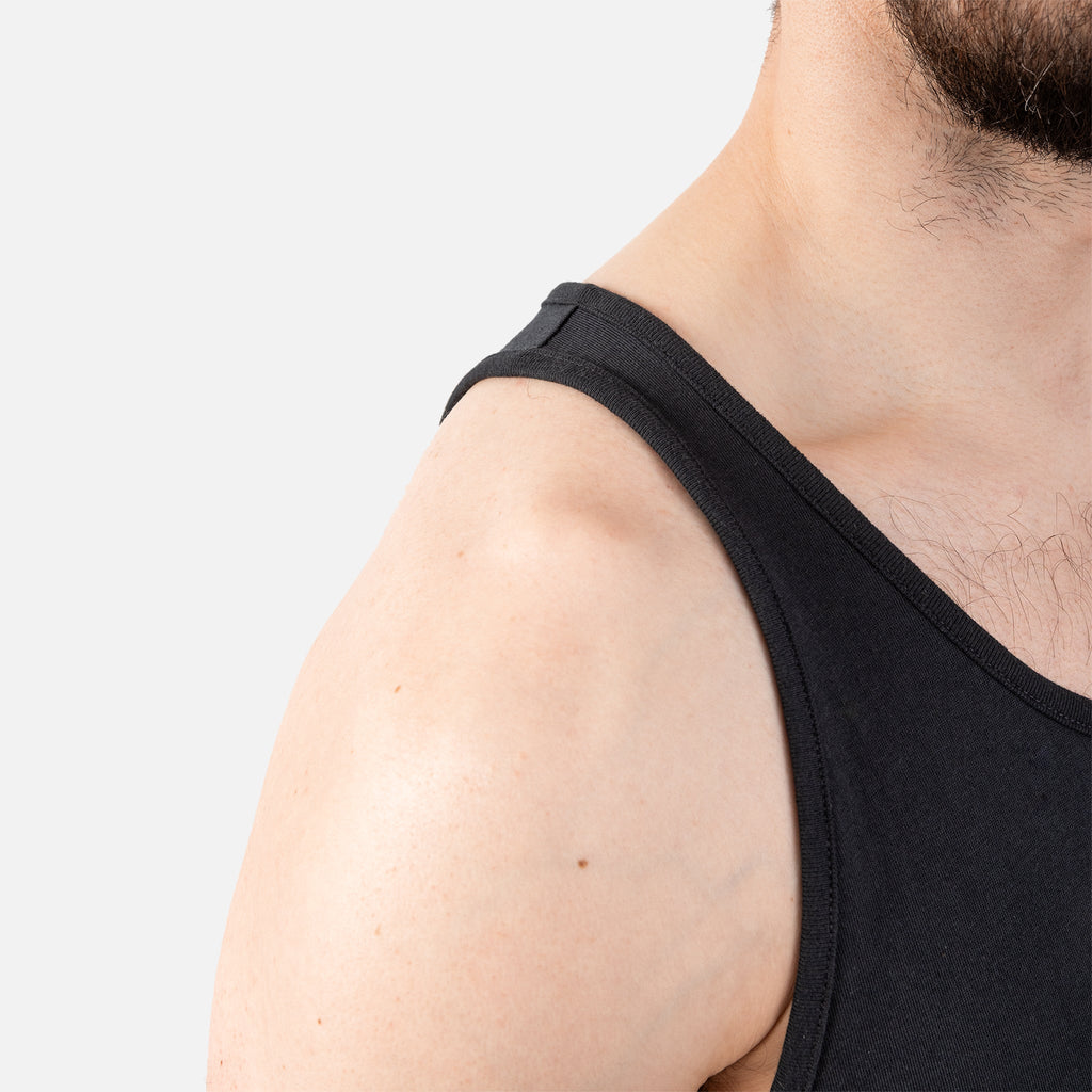Close up of right shoulder of BRUNT comfortable work tank top in black
