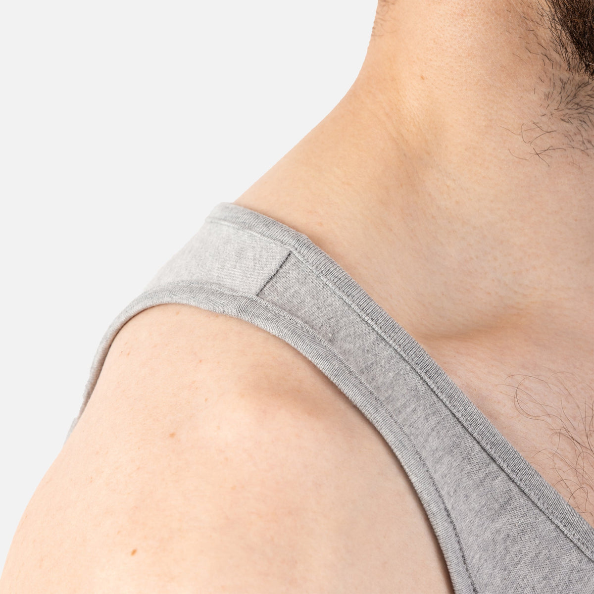 Close up of right shoulder of BRUNT comfortable work tank top in light grey heather