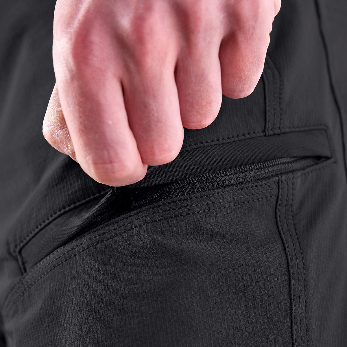 Zipper pocket of BRUNT water resistant durable breathable work pant in black