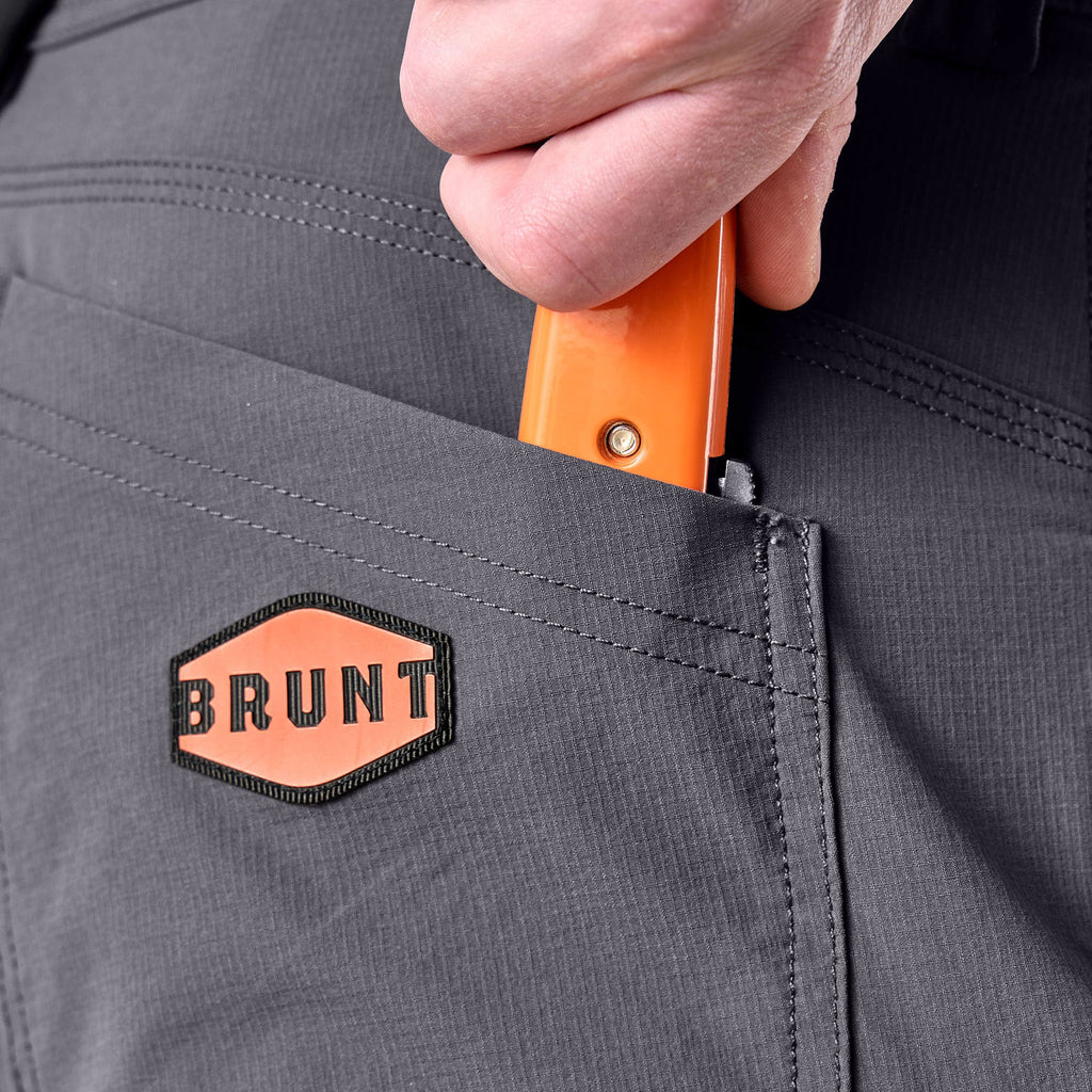 Back pocket of BRUNT water resistant durable breathable work pant in charcoal/black