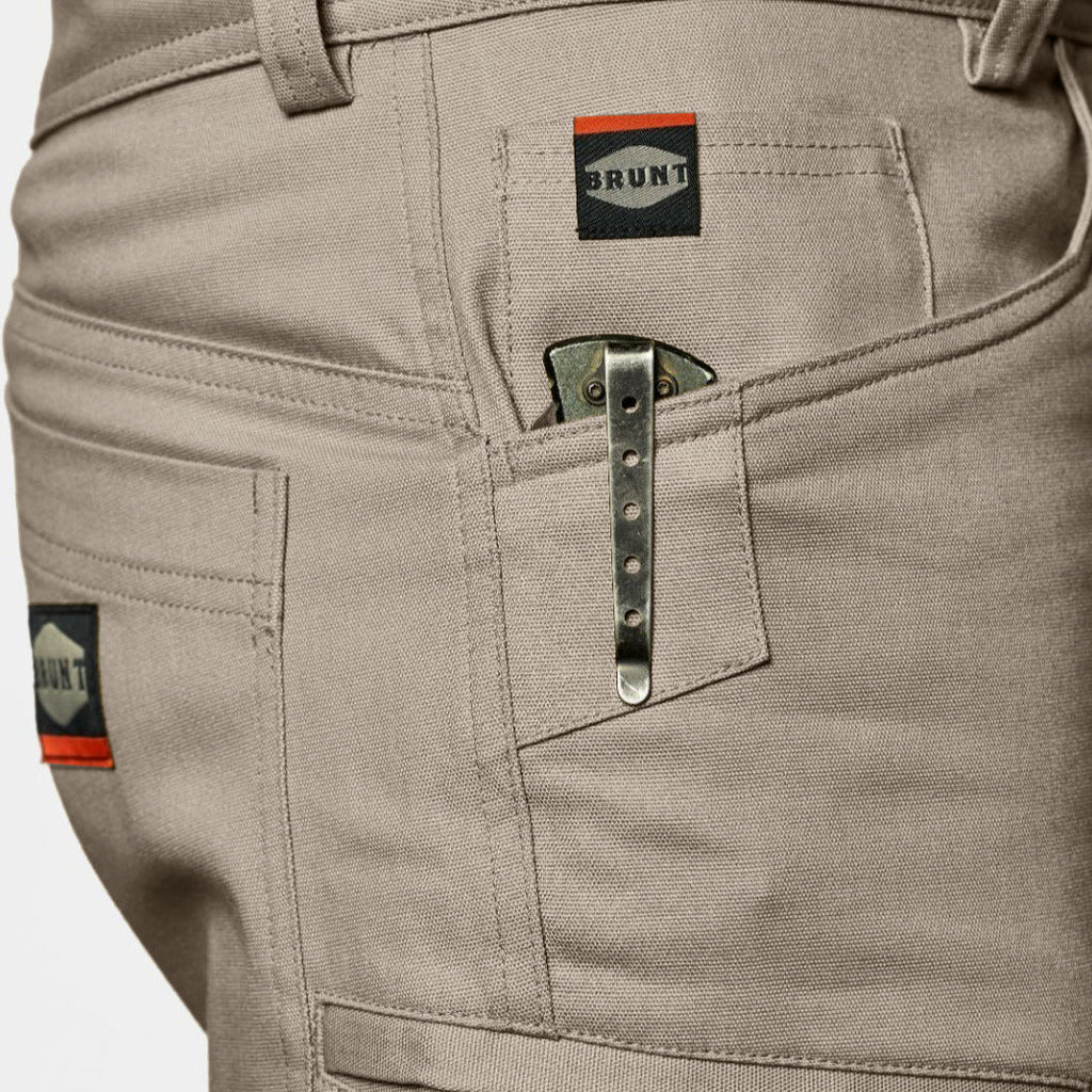 View 2 front pocket reinforcements of BRUNT abrasion resistant torra hd work shorts in khaki to hold knife * 1