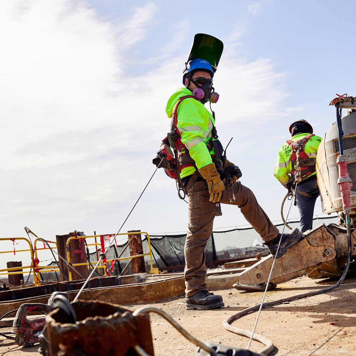Man on jobsite wearing the BRUNT hi-visibilty ANSI rate shevlin hoodie