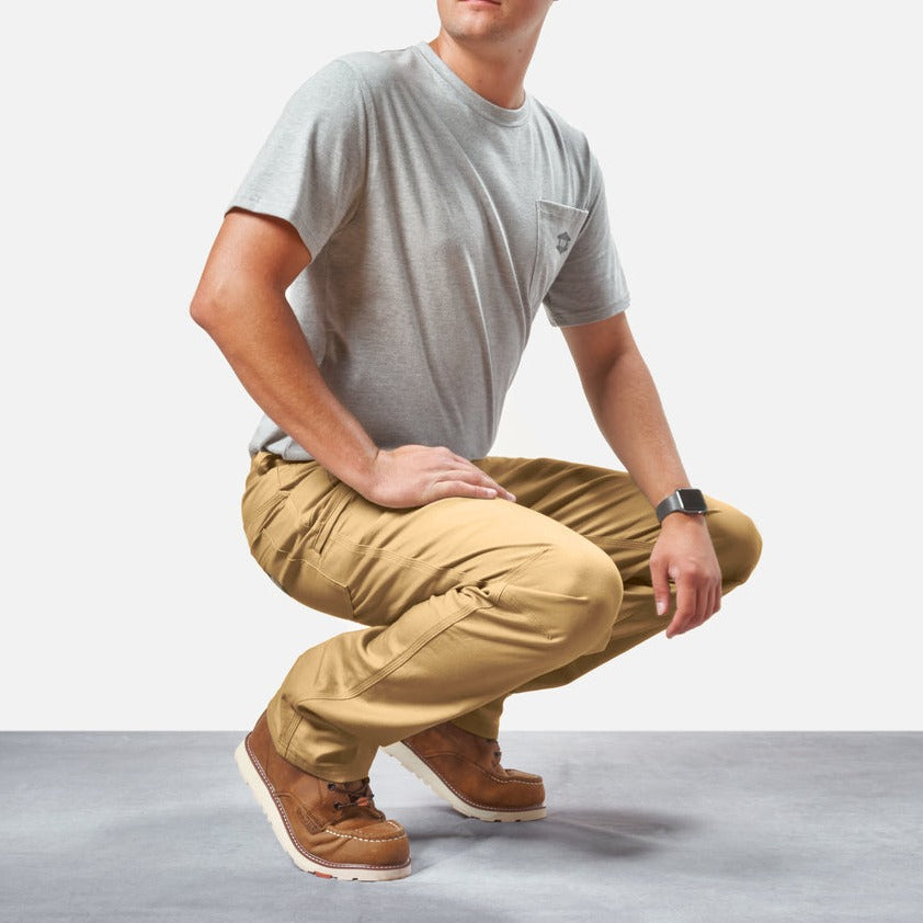 Squatting in BRUNT water resistant stretch torra work pant in tan * 1