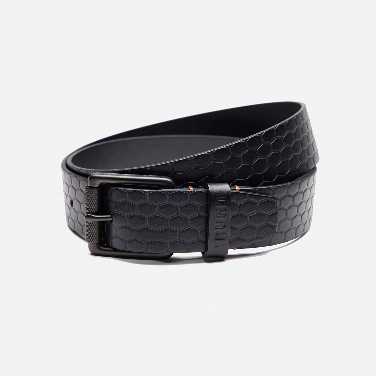 BRUNT leather belt with BRUNT logo pattern in black rolled up