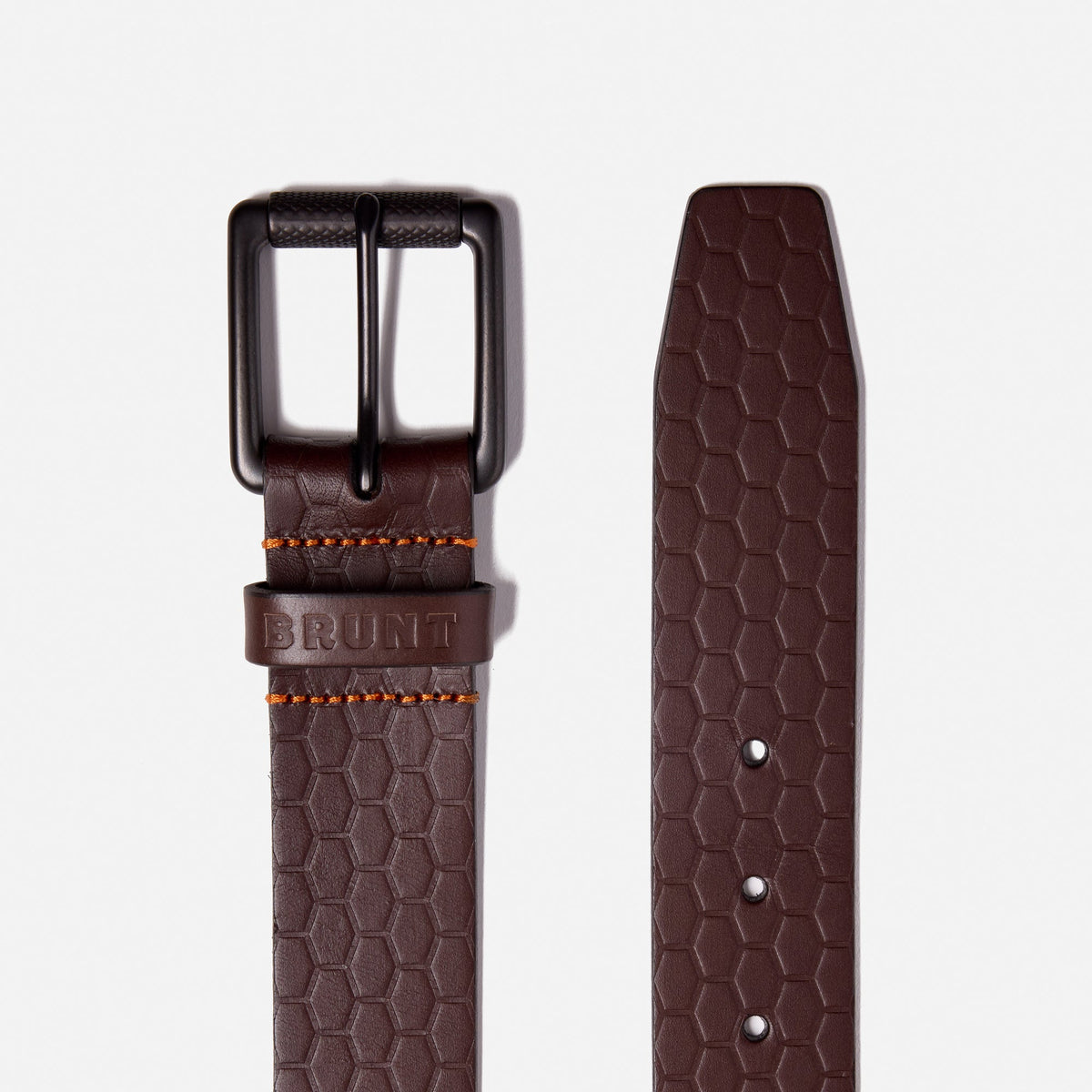 Buckle and end of BRUNT leather belt with BRUNT logo pattern in dark brown