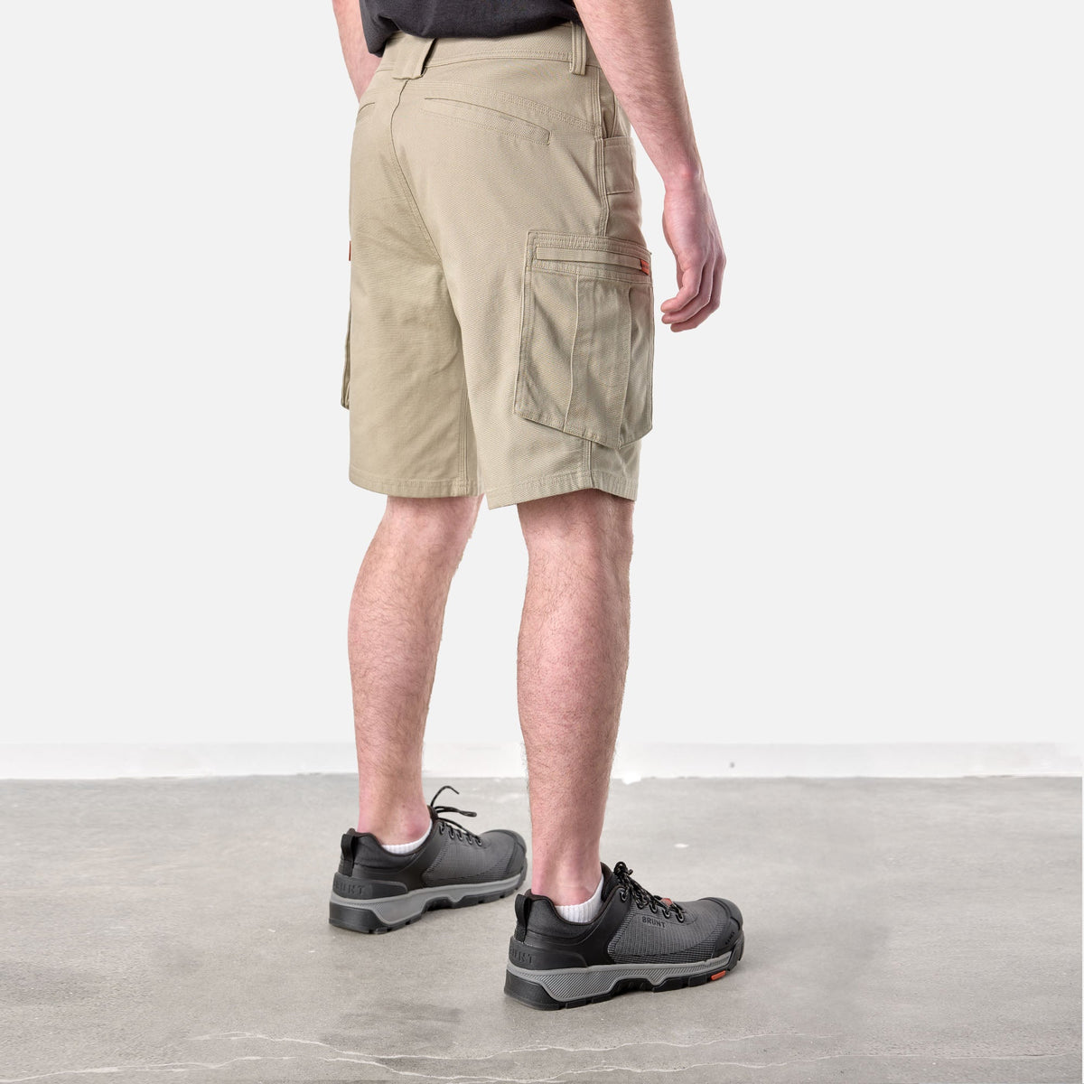 45 degree angle of back right side of BRUNT abrasion resistant cargo work shorts in khaki * 0