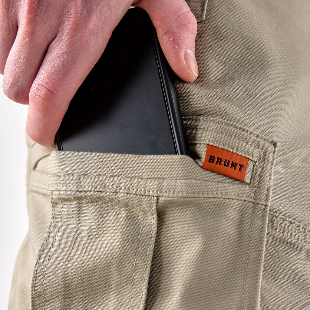 Putting phone in cargo pocket of BRUNT abrasion resistant cargo work shorts in khaki * 0