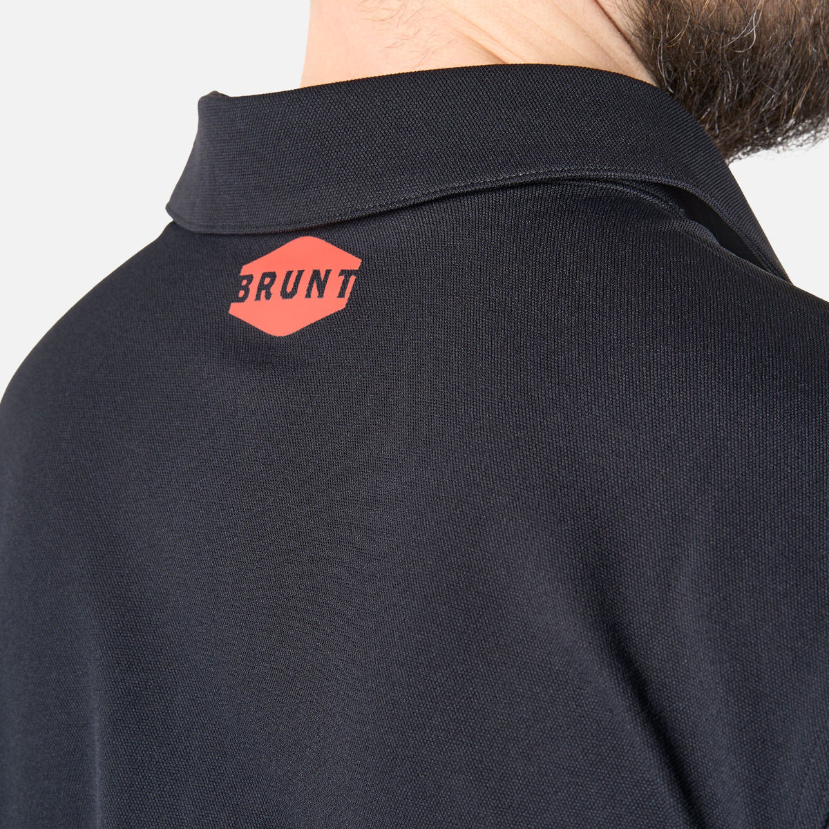 Close up of back collar of the BRUNT lightweight breathable polo with UPF protection in black * 1