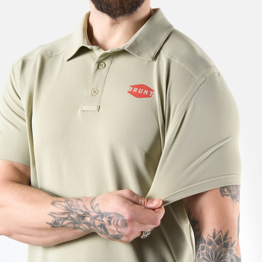 View 2 stretching front of the BRUNT lightweight breathable polo with UPF protection in khaki * 2
