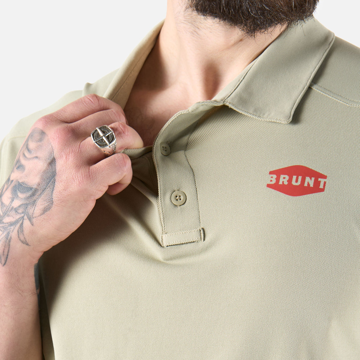 Close up of front collar of the BRUNT lightweight breathable polo with UPF protection in khaki  * 2