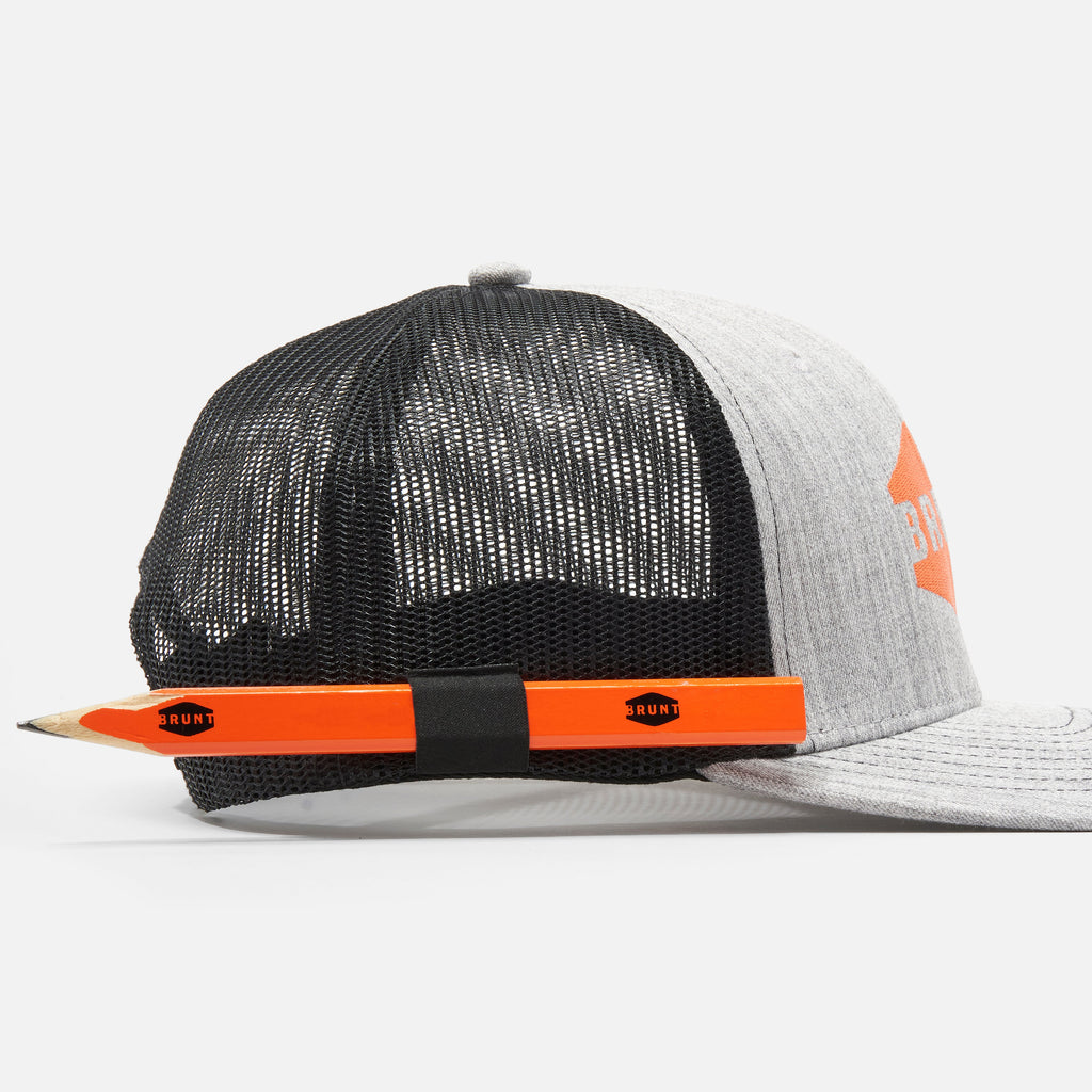View 2 orange carpenter pencils with BRUNT logo in BRUNT curved brim work hat with built in pencil holder and BRUNT logo in grey