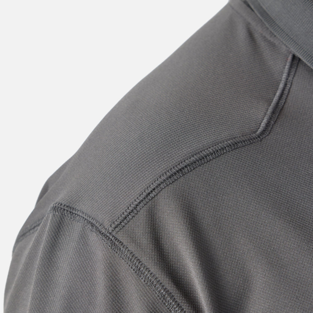 Close up of drop should seam of the BRUNT lightweight breathable ventilated tech polo with UPF protection in carbon * 1