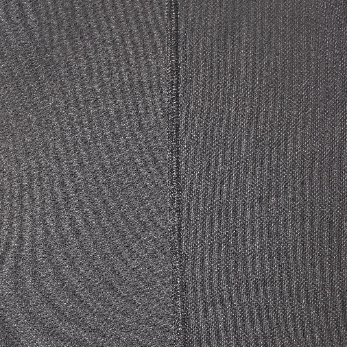 Close up of ventilation panel of the BRUNT lightweight breathable ventilated tech polo with UPF protection in carbon * 1