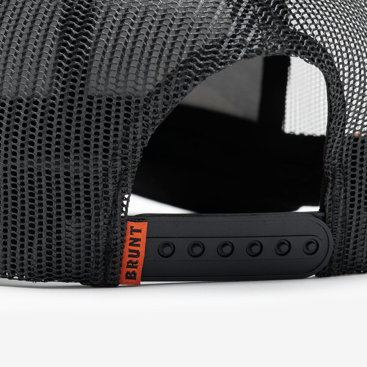 Back snaps of curved brim work hat with built in pencil holder and BRUNT usa 250 logo in limited edition black camo