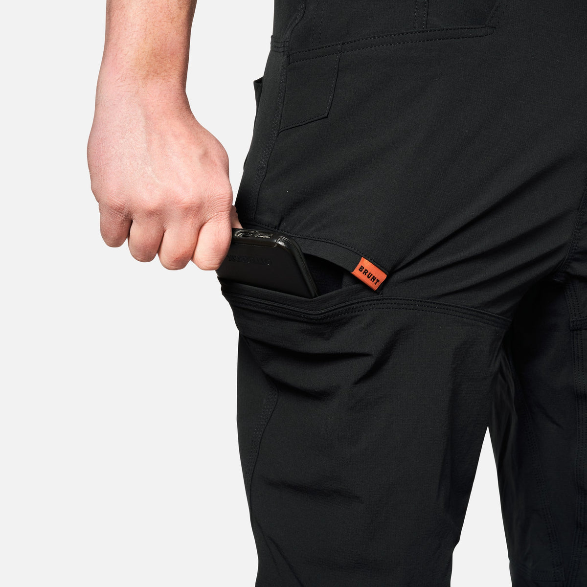 Stretching pocket of BRUNT water-resistant lightweight lined costello work pant in black