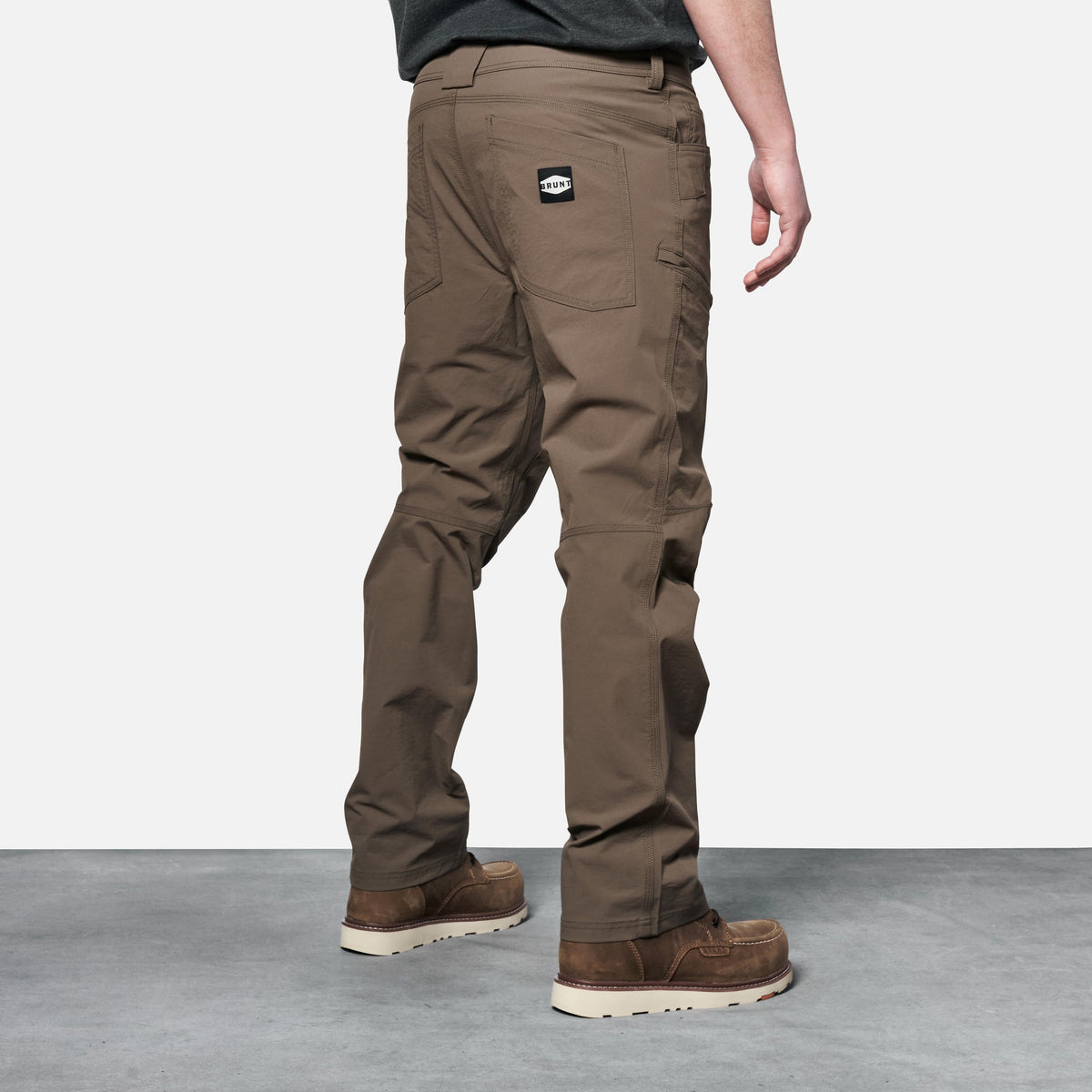 45 degree angle of back right side of BRUNT water-resistant lightweight lined costello work pant in brown