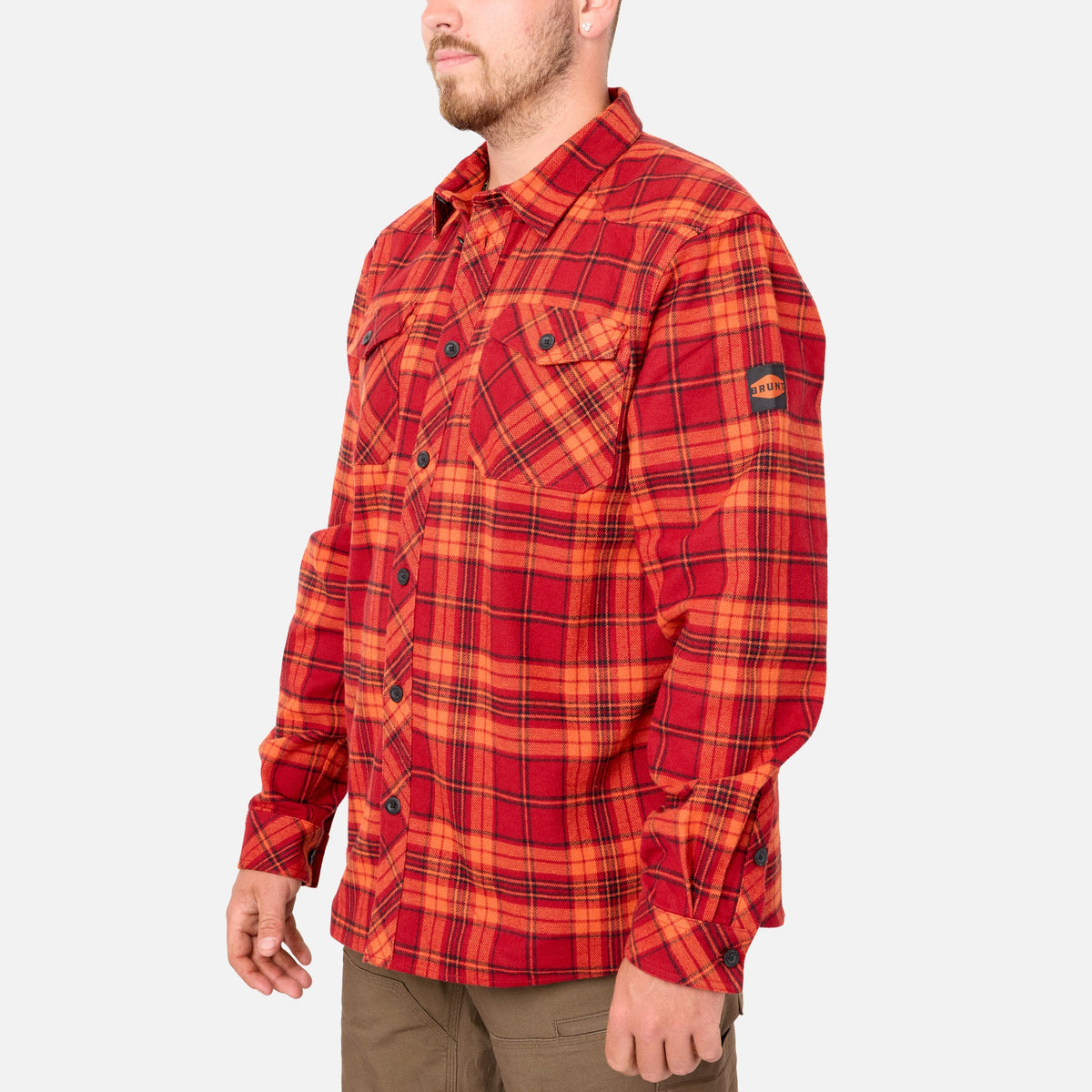 45 degree angle of the left BRUNT heavy duty stretch work flannel in orange plaid * 1