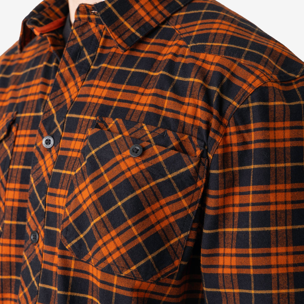 Front chest pocket of BRUNT comfortable stretch work flannel in orange plaid