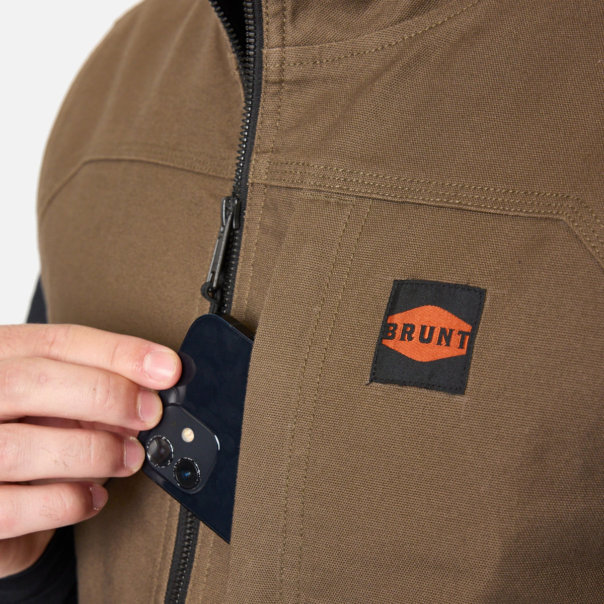 Front of chest phone pocket of the BRUNT quilted stretch canvas work vest in brown * 2