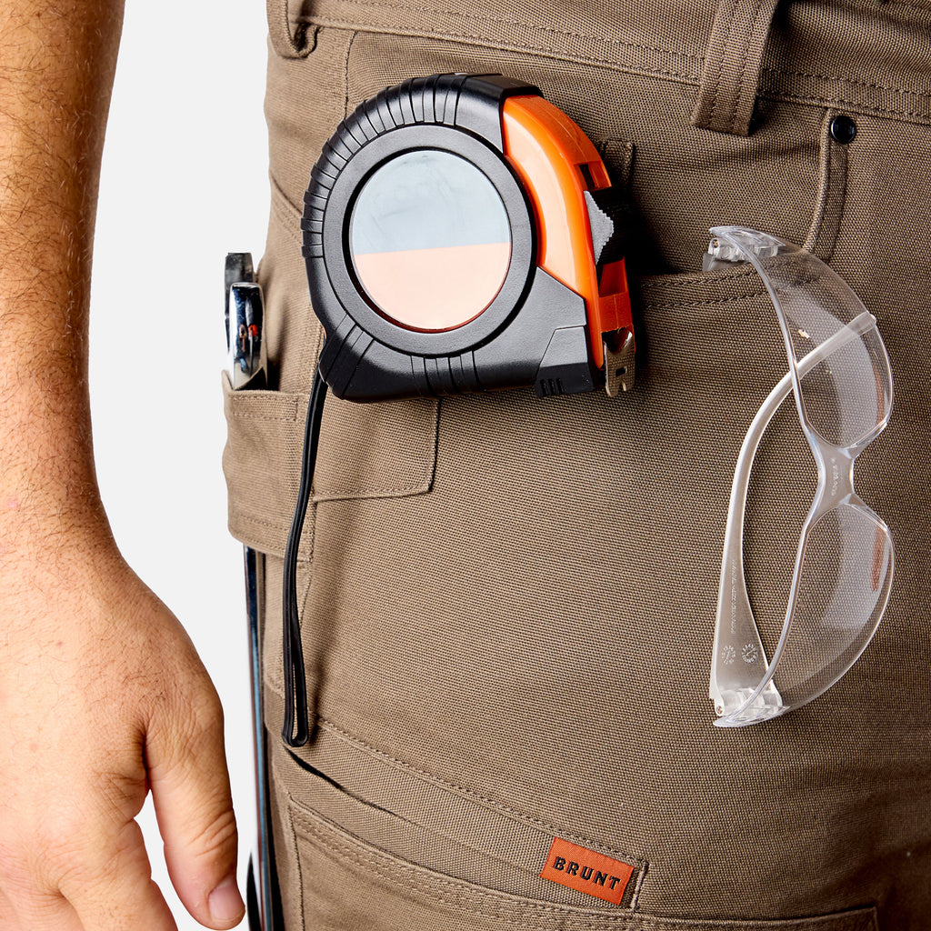 View 2 front pocket reinforcements of BRUNT water resistant double-knee torra hd utility work pant in brown to hold tools * 1