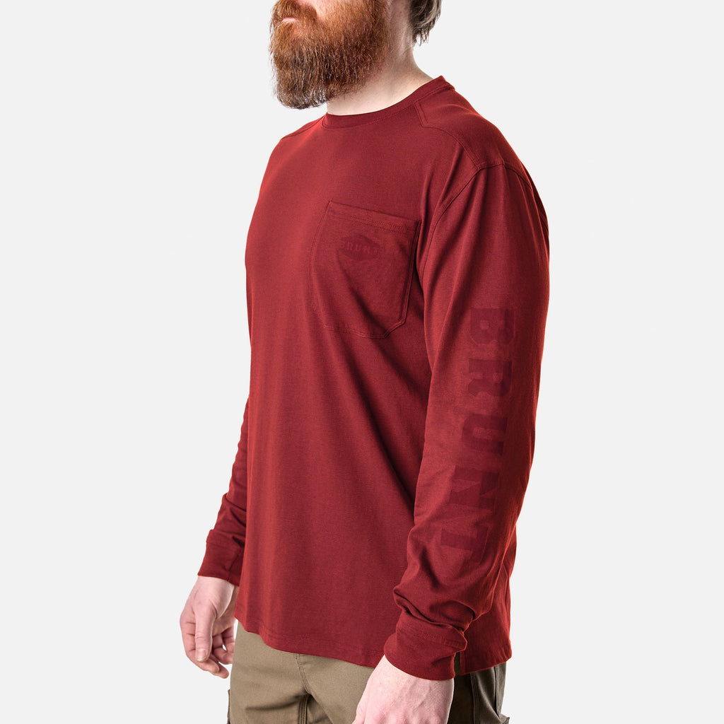 45 degree angle of the front left of the BRUNT high quality long sleeve pocket tee in brick red