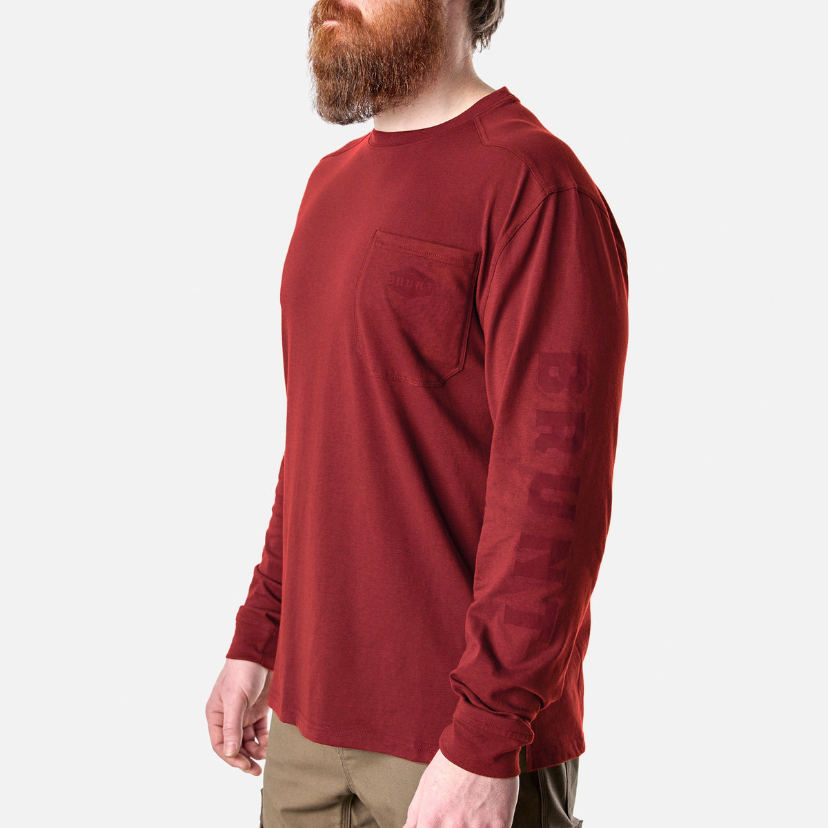 45 degree angle of the front left of the BRUNT high quality long sleeve pocket tee in brick red