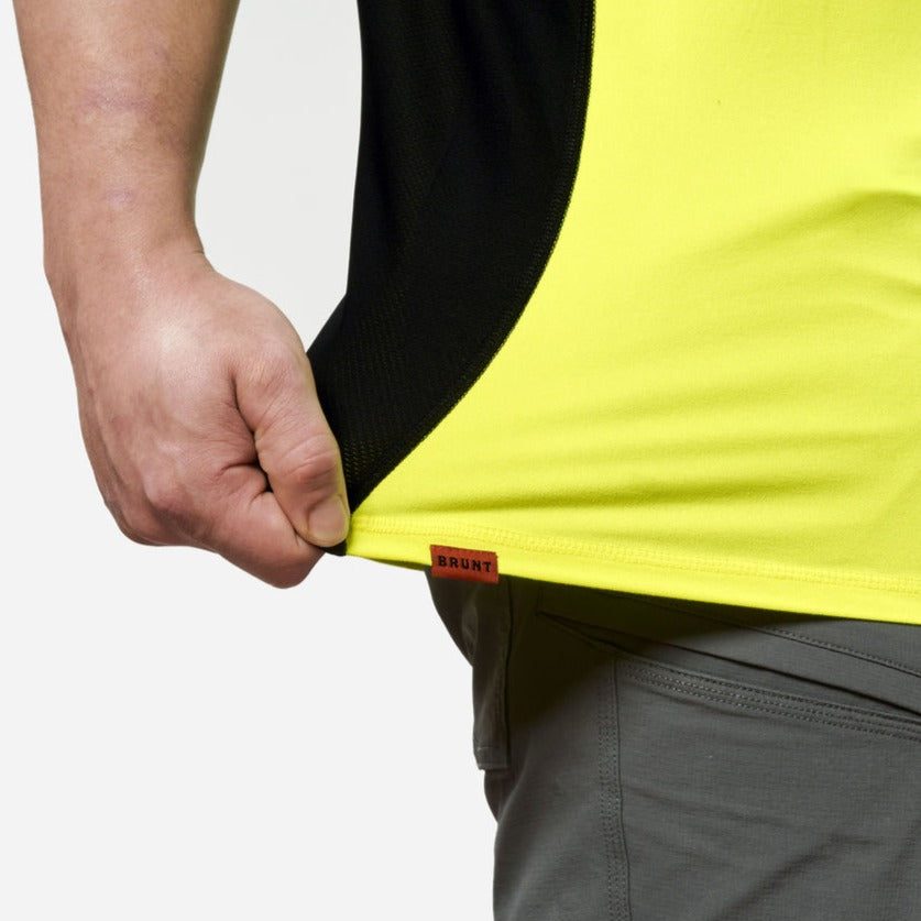 View 2 stretching hemline of the BRUNT lightweight mckenna sun tee with UPF protection in hi vis yellow * 1