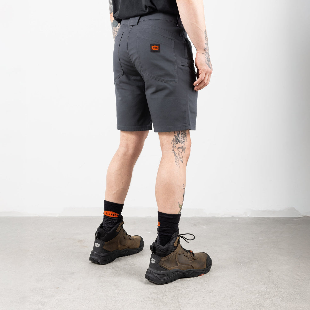 45 degree angle of back right of the BRUNT 9 inch water resistant stretch work short in charcoal
