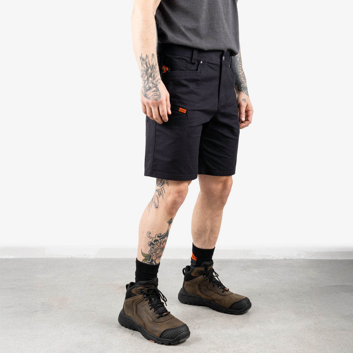 45 degree angle of front right of the BRUNT 9 inch water resistant stretch work short in black