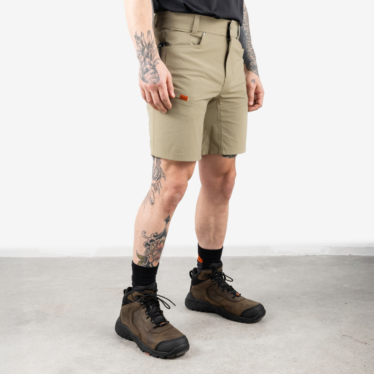 45 degree angle of front right side of BRUNT 9 inch lightweight breathable costello work shorts in khaki