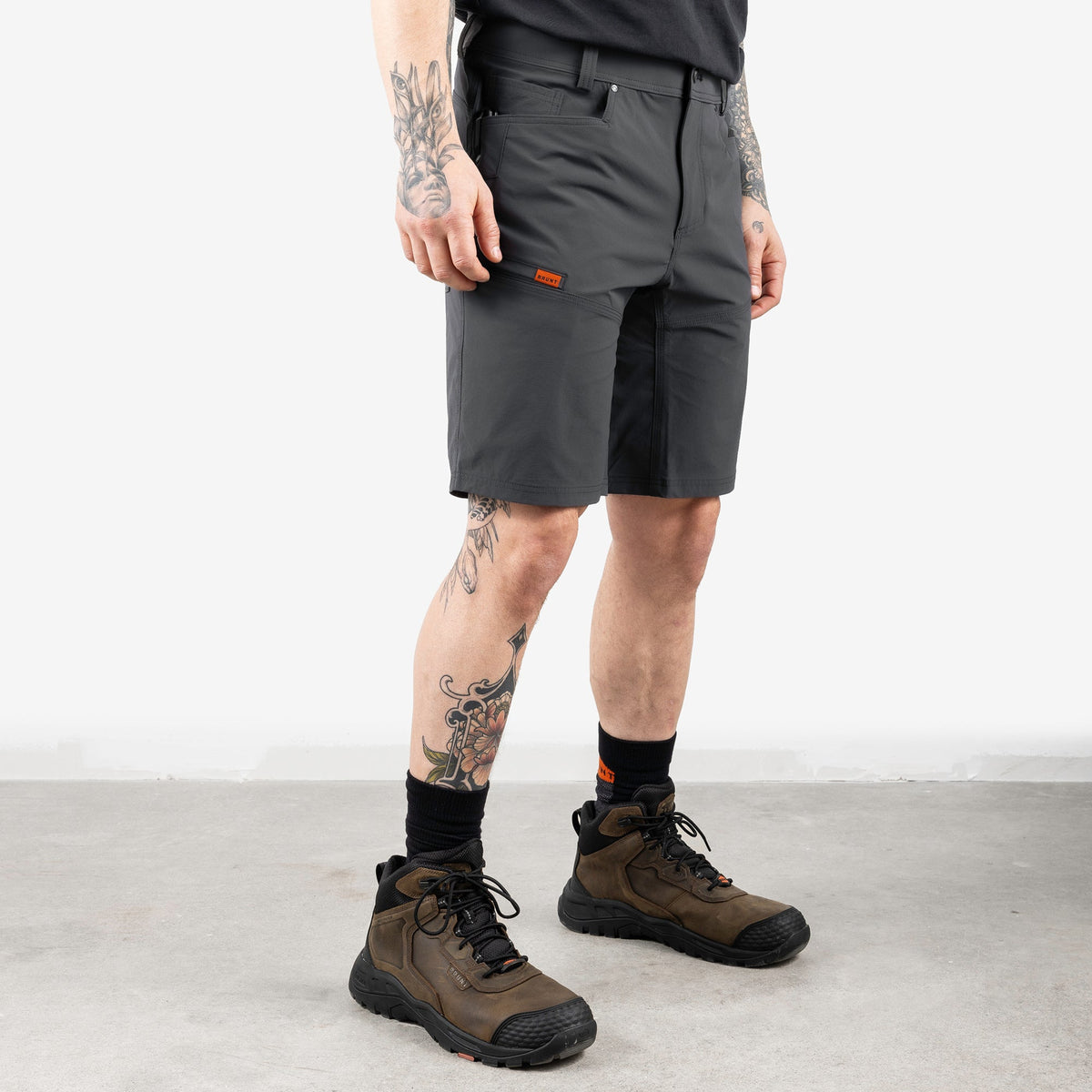 45 degree angle of front right side of BRUNT 11 inch lightweight breathable costello work shorts in charcoal