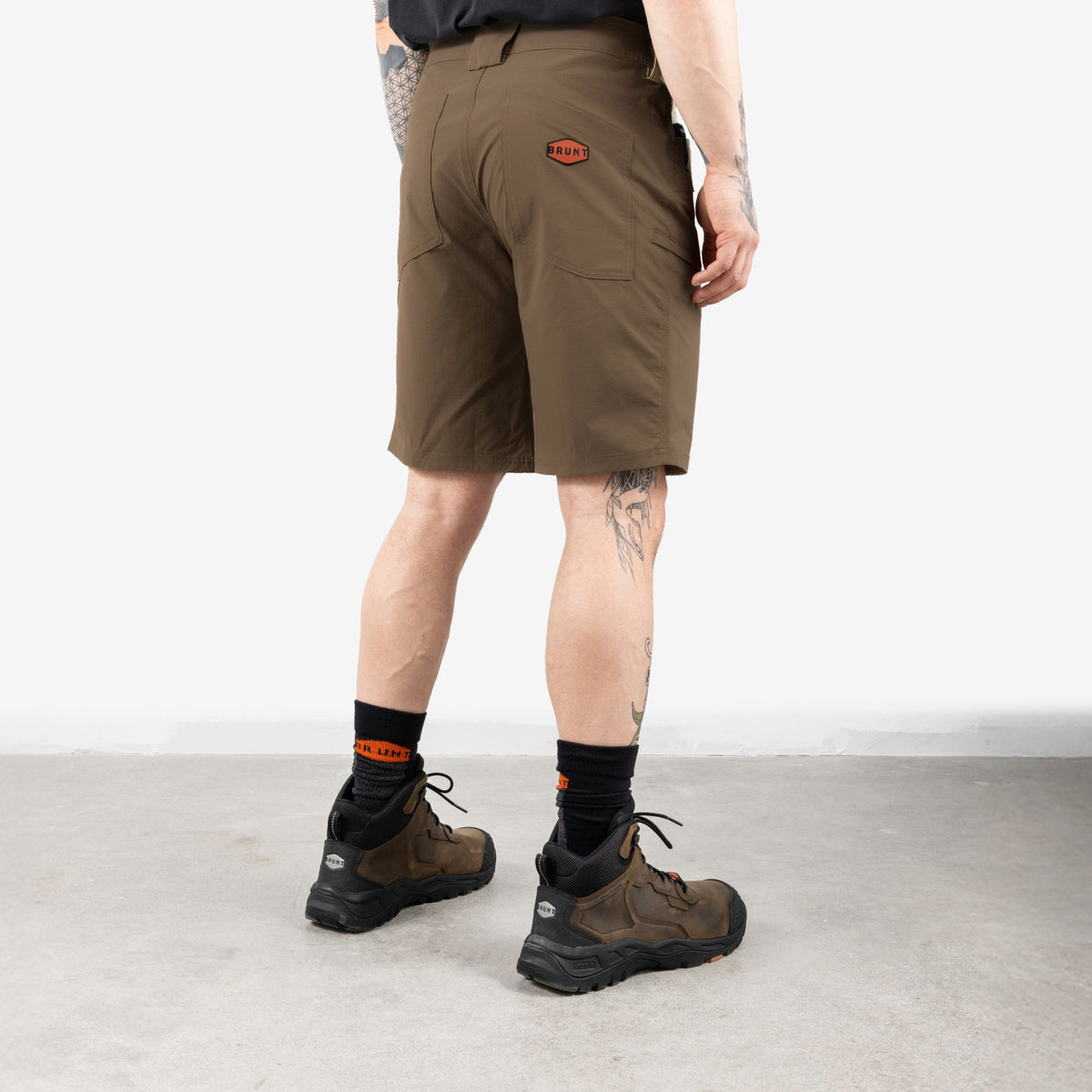 45 degree angle of back right side of BRUNT 11 inch lightweight breathable costello work shorts in brown