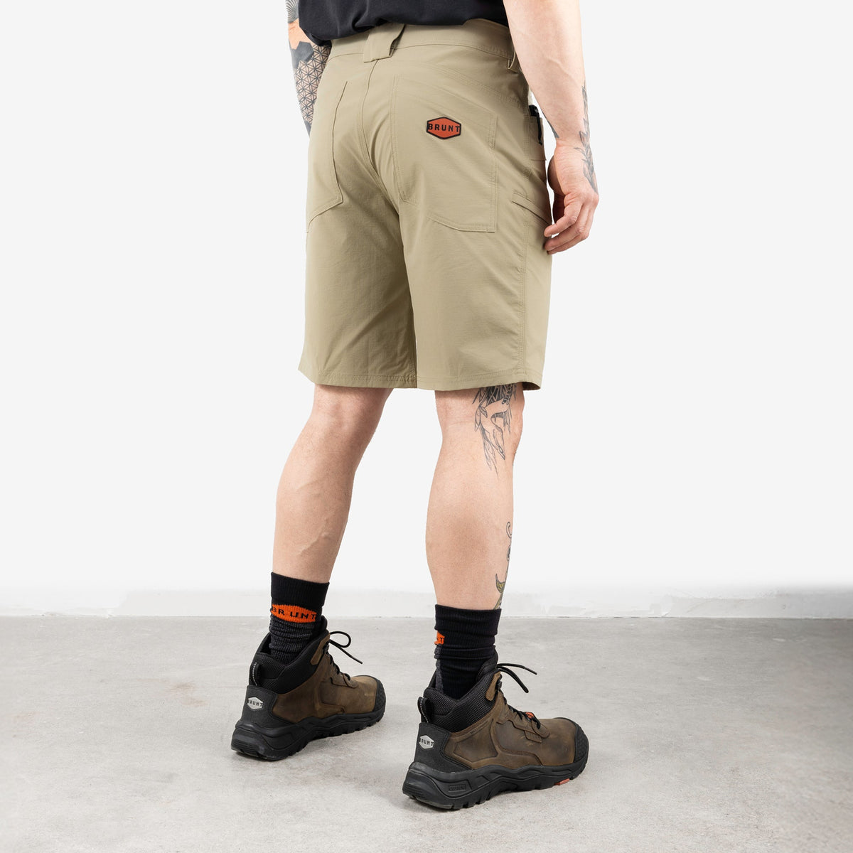 45 degree angle of back right side of BRUNT 11 inch lightweight breathable costello work shorts in khaki