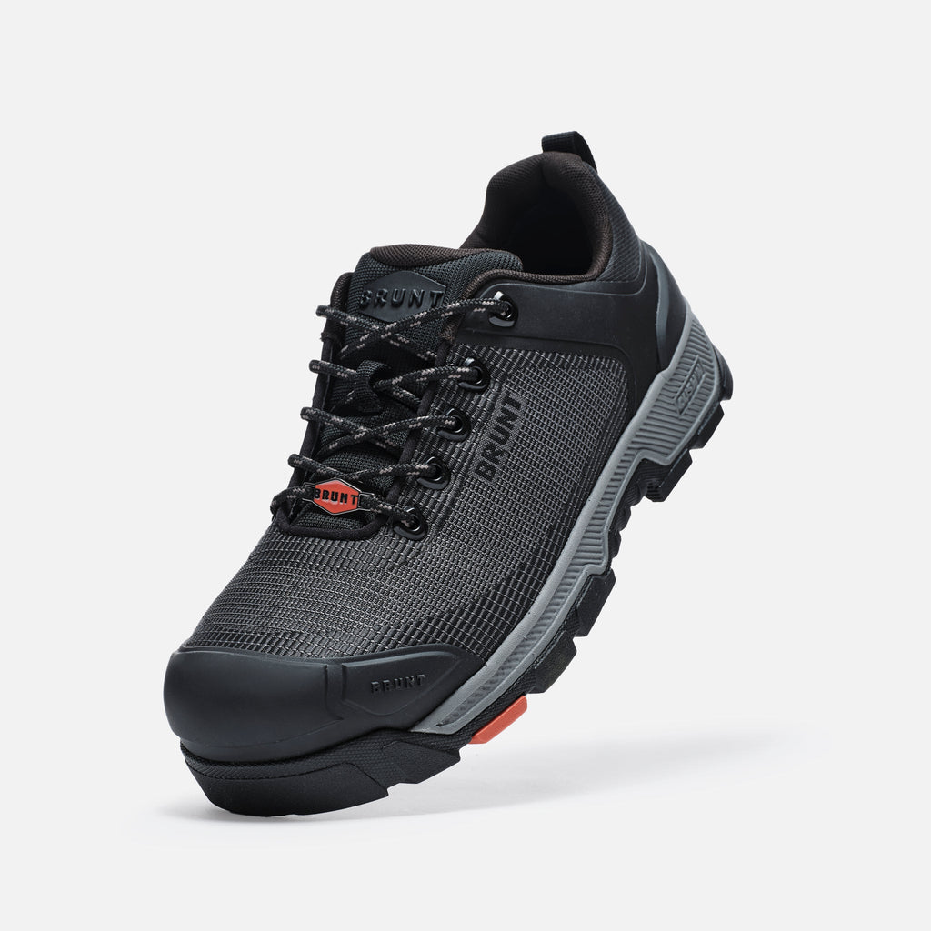 45 degree angle of the left BRUNT 4 inch low top 90 degree heel composite toe work shoe in black