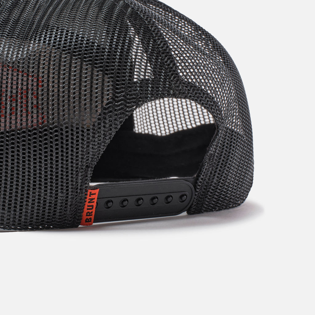 Back snaps of flat brim work hat with built in pencil holder and BRUNT logo in black and army green camo