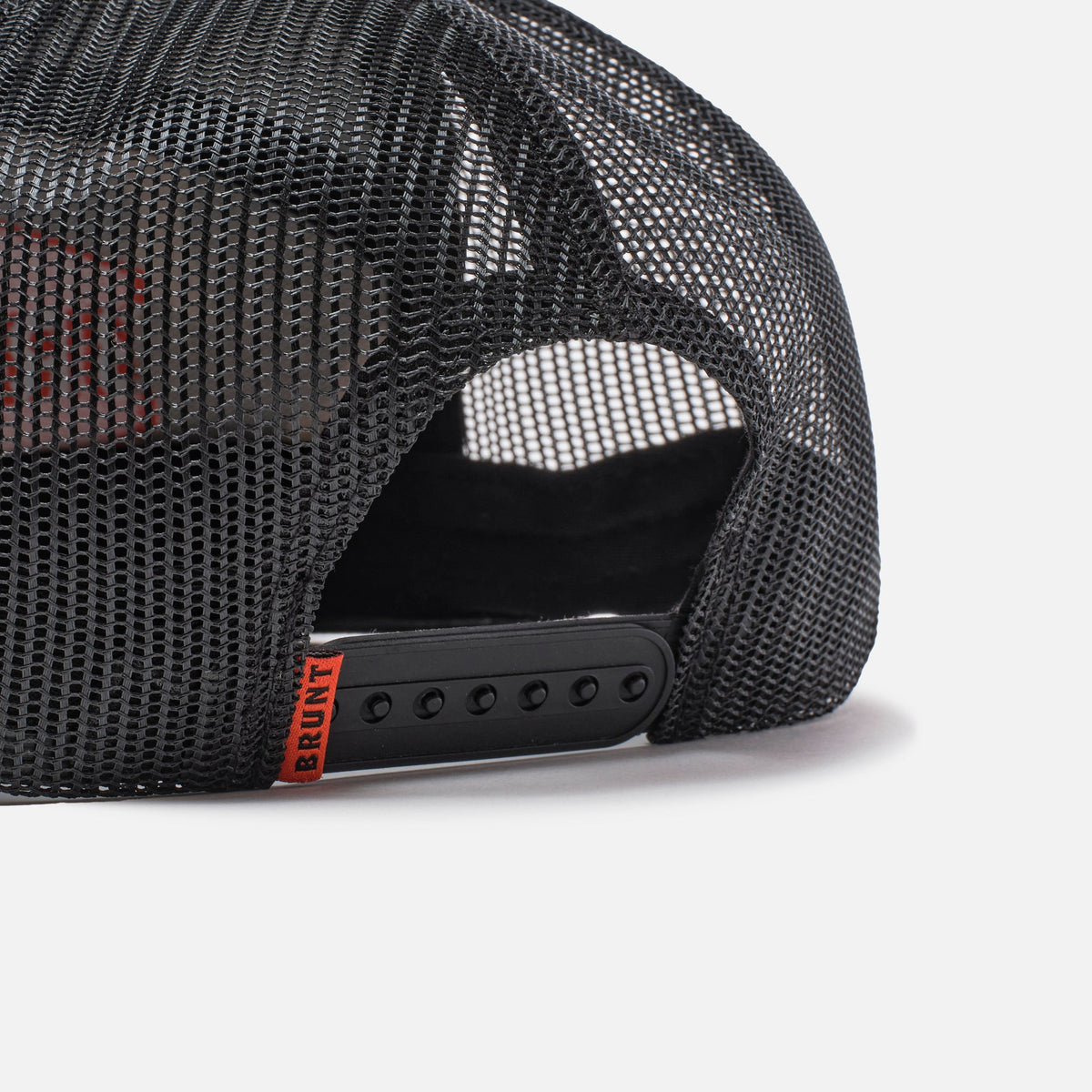 Back snaps of flat brim work hat with built in pencil holder and BRUNT logo in black and army green camo