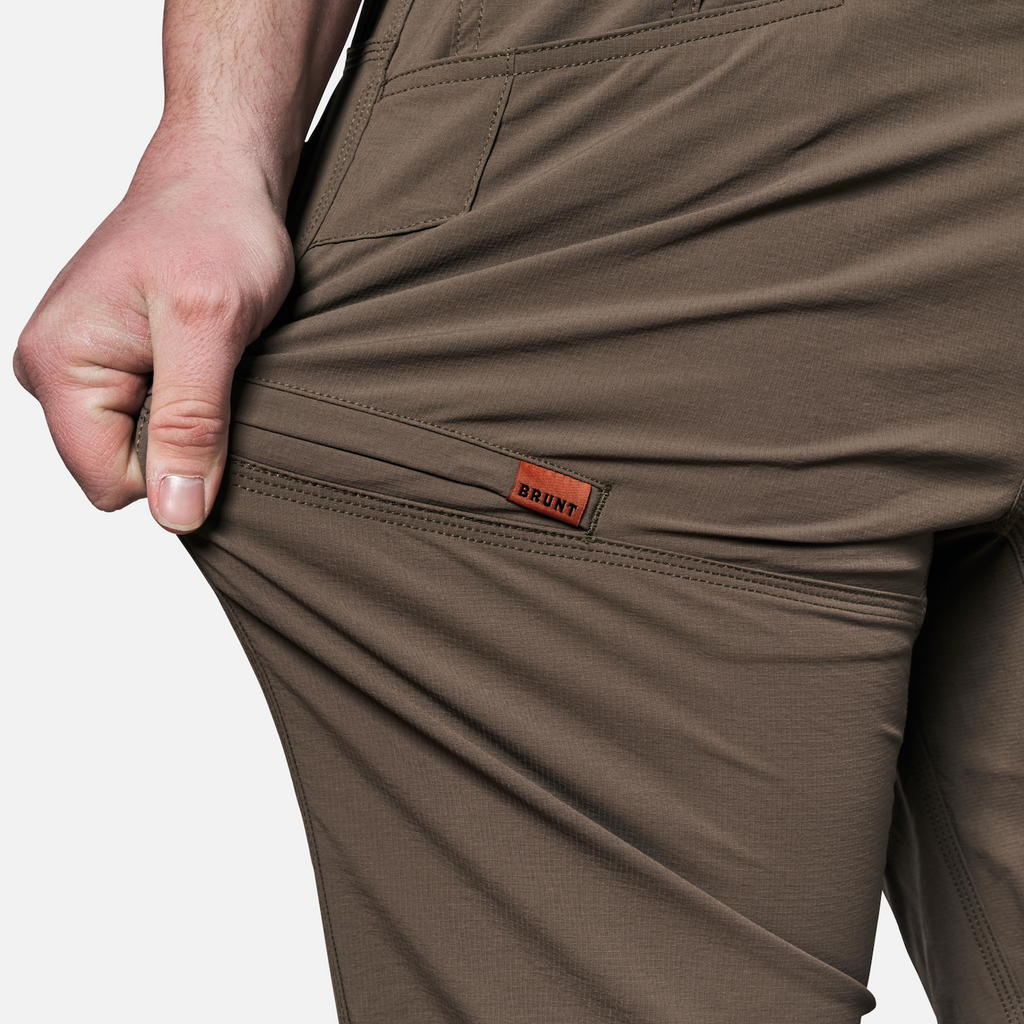 View 2 stretching pocket of BRUNT water-resistant lightweight breathable costello work pant in brown * 2