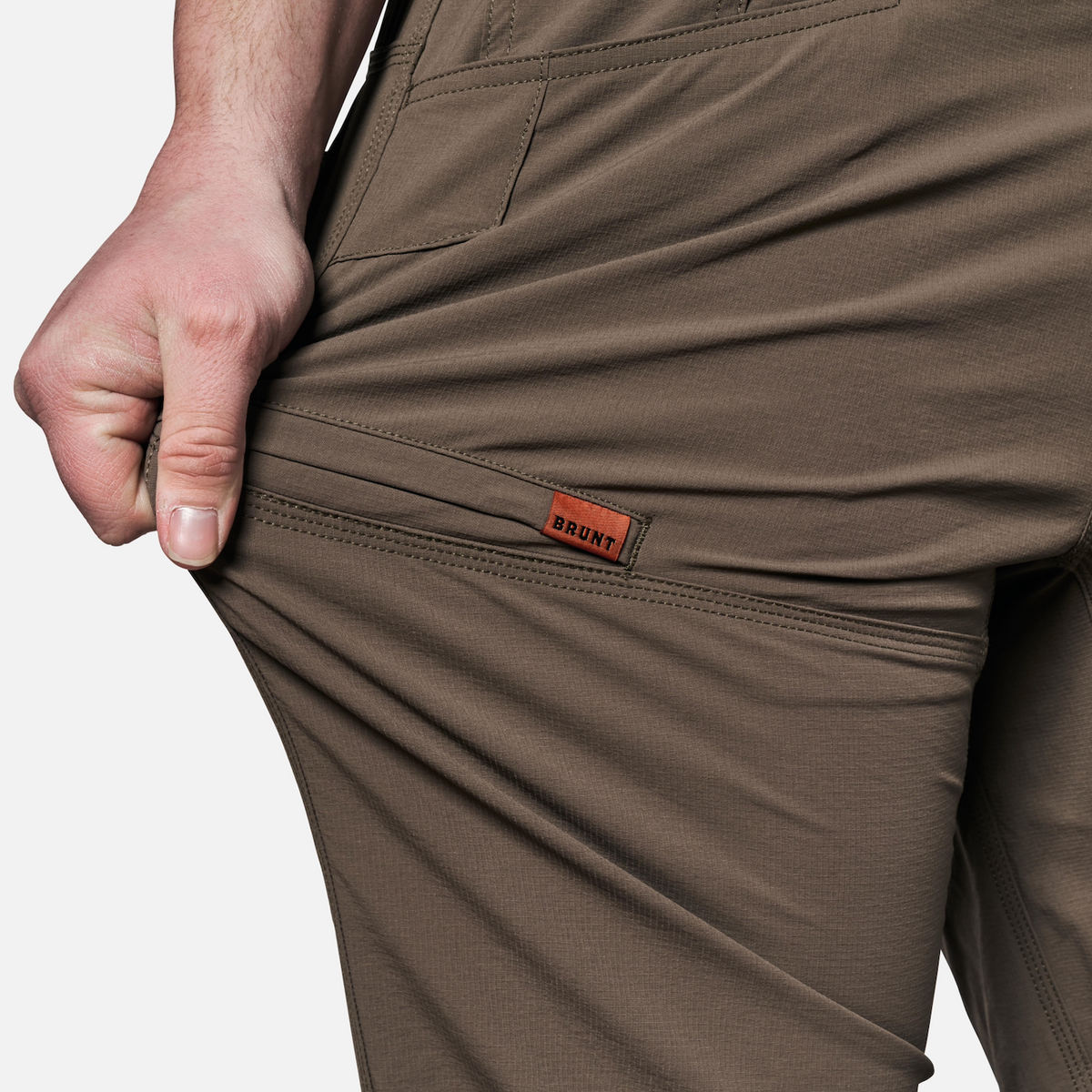 View 2 stretching pocket of BRUNT water-resistant lightweight breathable costello work pant in brown * 2
