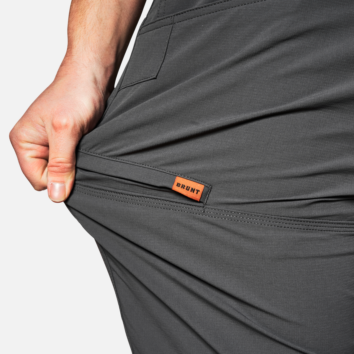 Stretching pocket of BRUNT water-resistant lightweight breathable costello work pant in charcoal * 1