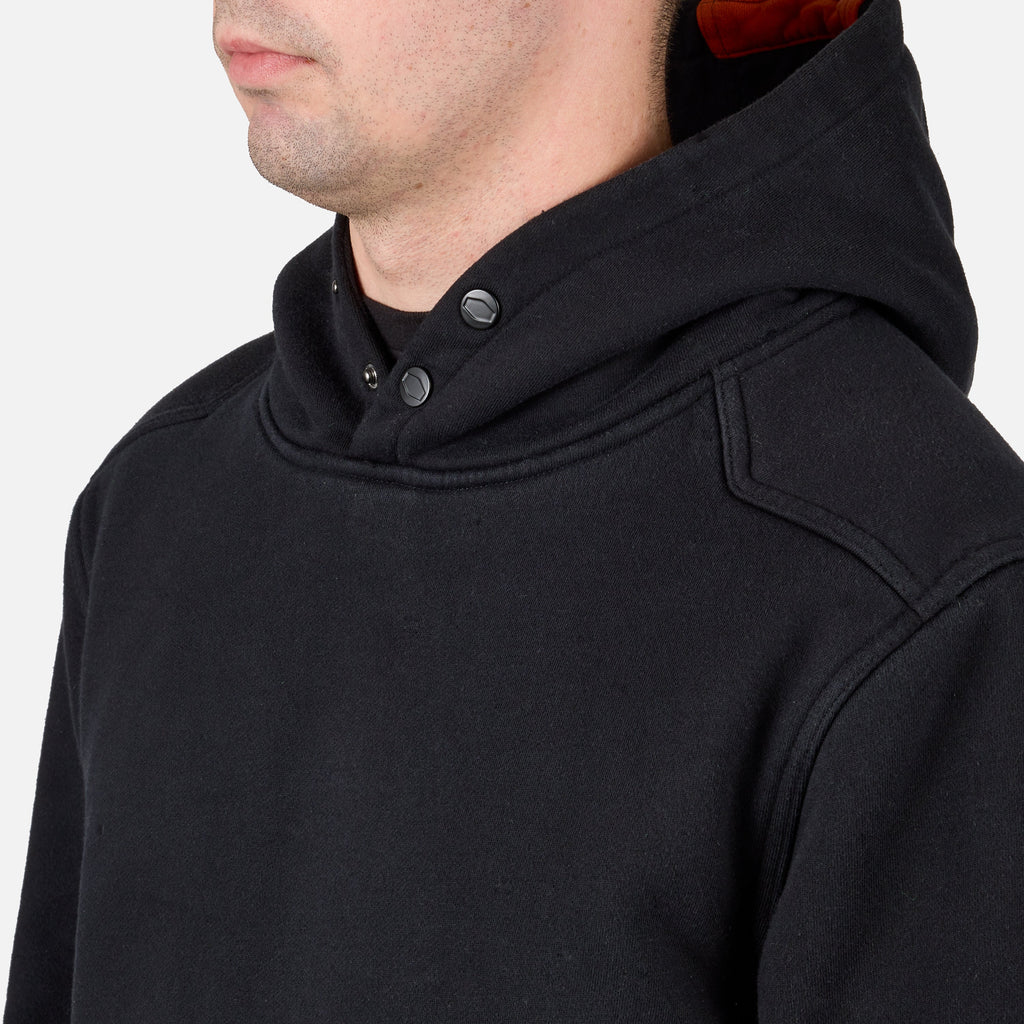 Front of button snaps of the BRUNT heavyweight water-resistant workwear hoodie in black