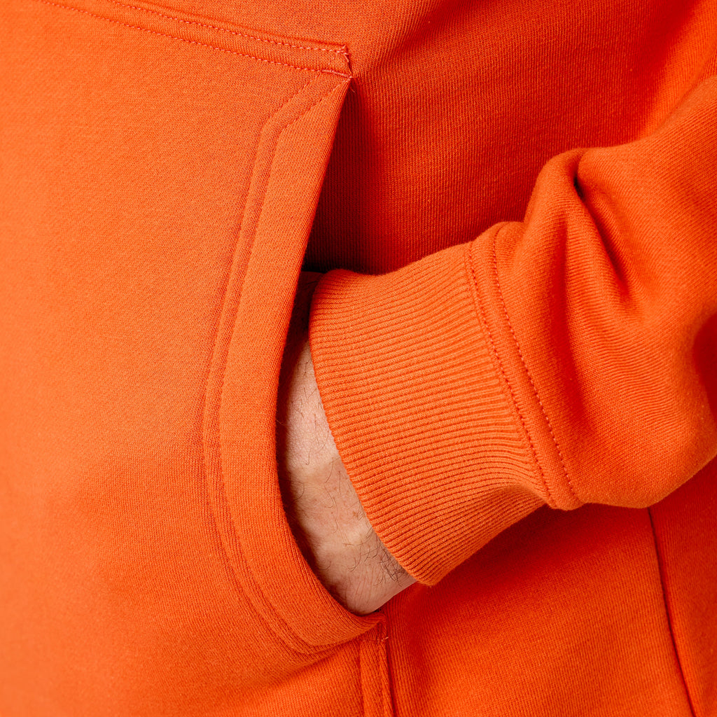 Front of hand pocket of the BRUNT water resistant shevlin work hoodie in BRUNT orange